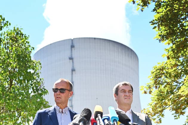 Prime Minister Dr Markus Soeder visits together with the chairman of the CDU CSU parliamentary group, Friedrich Merz the nuclear power plant Isar 2 on 04 08 2022 cooling tower