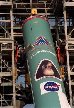 The first stage of a Boeing Delta rocket is lifted into place in the gantry on Launch Pad 17-A, Cape Canaveral Air Force Station. The rocket will carry the 2001 Mars Odyssey Orbiter, scheduled for launch April 7, 2001. Mars Odyssey contains three science instruments: THEMIS, the Gamma Ray Spectrometer (GRS), and the Mars Radiation Environment Experiment (MARIE). THEMIS will map the mineralogy and morphology of the Martian surface using a high-resolution camera and a thermal infrared imaging spectrometer. The GRS will achieve global mapping of the elemental composition of the surface and determine the abundance of hydrogen in the shallow subsurface. The MARIE will characterize aspects of the near-space radiation environment with regards to t Copyright: xpiemagsx piemagsspace-17010 !ACHTUNG AUFNAHMEDATUM GESCHÄTZT!