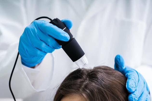 Dermatologist Using Trichoscope For Hair Fall Treatment, Close-up Of Dermatologist Using Trichoscope For Hair Fall Treatment His Clinic model released, Symbolfoto , 06.03.2020 17:36:26, Copyright: xAndreyPopovx Panthermedia28182649.jpg