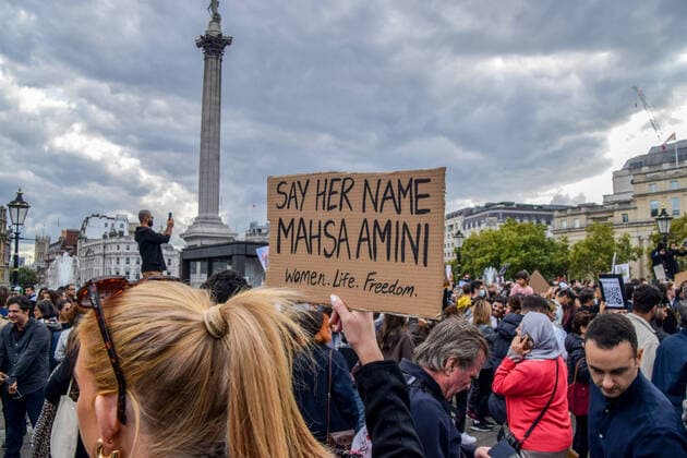 September 24, 2022, London, United Kingdom: A protester holds a placard which states Say her name, Mahsa Amini during the demonstration. Thousands of Iranians and other protesters gathered in Trafalgar Square in response to the death of Mahsa Amini, who died in police custody in Iran after being detained for allegedly not wearing a head scarf (hijab) properly in public. London United Kingdom - ZUMAs197 20220924_zaa_s197_221 Copyright: xVukxValcicx