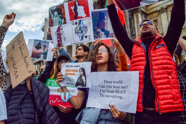 September 24, 2022, London, United Kingdom: Protesters hold portraits of Mahsa Amini and various placards during the demonstration. Thousands of Iranians and other protesters gathered in Trafalgar Square in response to the death of Mahsa Amini, who died in police custody in Iran after being detained for allegedly not wearing a head scarf (hijab) properly in public. London United Kingdom - ZUMAs197 20220924_zaa_s197_223 Copyright: xVukxValcicx