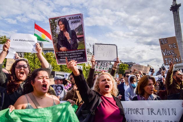 September 24, 2022, London, United Kingdom: A protester holds a portrait of Mahsa Amini during the demonstration. Thousands of Iranians and other protesters gathered in Trafalgar Square in response to the death of Mahsa Amini, who died in police custody in Iran after being detained for allegedly not wearing a head scarf (hijab) properly in public. London United Kingdom - ZUMAs197 20220924_zaa_s197_230 Copyright: xVukxValcicx