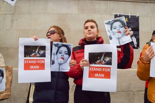 September 27, 2022, London, United Kingdom: Protesters hold pictures of Mahsa Amini and placards in solidarity with protests in Iran during the demonstration in Trafalgar Square. Protesters continue to gather in London in response to the death of Mahsa Amini, who died in police custody in Iran after being detained for allegedly not wearing a head scarf (hijab) properly in public. London United Kingdom - ZUMAs197 20220927_zaa_s197_108 Copyright: xVukxValcicx