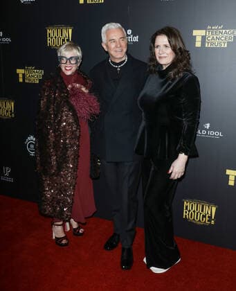 September 29, 2022, London, United Kingdom: Baz Luhrmann (C), Catherine Martin (L) and a guest attend the gala night for Moulin Rouge The Musical and Teenage Cancer Trust at the Piccadilly Theatre in London. London United Kingdom - ZUMAs197 20220929_zaa_s197_229 Copyright: xBrettxCovex