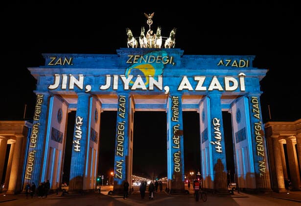 Woman Life Freedom Berlin, 13 12 2022 Organized by the human rights organization HÁWAR help and in solidarity with the protests in Iran, the Brandenburg Gate is illuminated with the lettering Jin - Jiyan - Azadi Kurdish , and Zan - Zendegi - Azadi Persian and in German Woman - Life - Freedom Berlin Berlin Germany