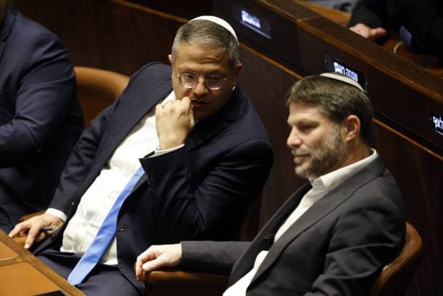 Right-wing Knesset members Itamar Ben-Gvir and Bezalel Smotrich attend a special session of the Knesset to approve and swear in a new right-wing government in Jerusalem on Thursday, December 29, 2022. Netanyahu became the Prime Minister of Israel for the third time. Pool  JERX2022122911 AMIRxCOHEN