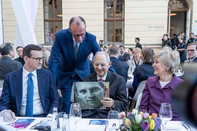 Ceremony Wolfgang Schäuble 50 years in the German Bundestag Friedrich Merz hands over to Wolfgang Schäuble a pressed record with o