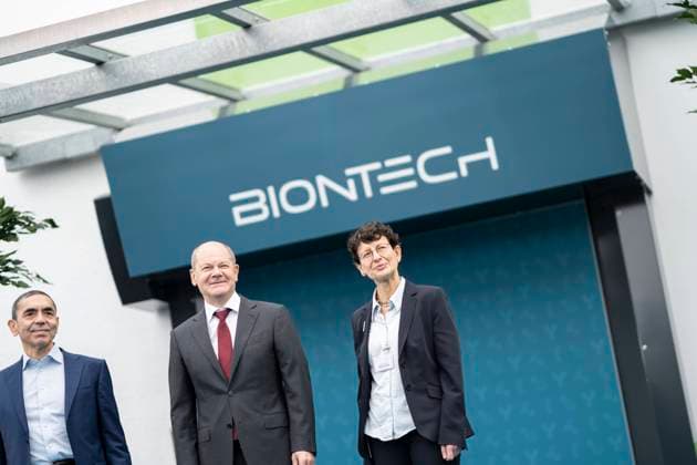 German Chancellor visits BioNTech on the occasion of the constructional completion of the plasmid production in Marburg Ugur Sahin, founder and CEO Biontech SE left and