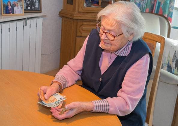 Old woman counts money model released