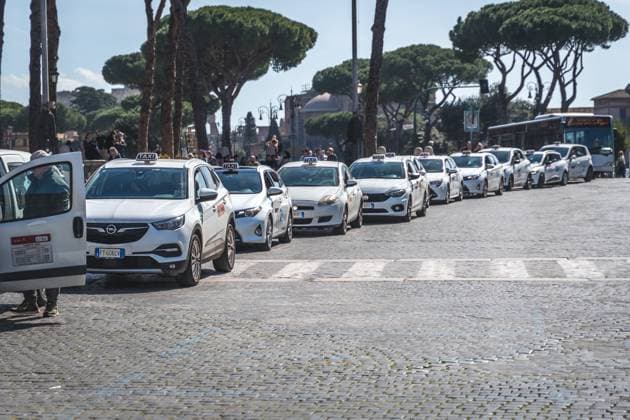 Rome, Italy - 13 March 2023: Cab in Rome, cab stand with many cabs waiting for tourists in Rome, Italy