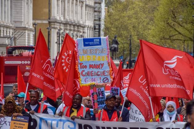 May 1, 2023, London, England, United Kingdom: Unite the union members pass through Whitehall. Crowds marched through Westminster in support of the NHS and NHS staff. London United Kingdom - ZUMAv130 20230501_zip_v130_077 Copyright: xVukxValcicx