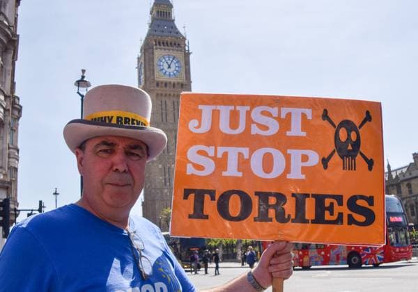 May 24, 2023, London, England, United Kingdom: Anti-Brexit activist STEVE BRAY holds a Just Stop Oil-style sign which states Just Stop Tories, as anti-Tory and anti-Brexit protesters stage their weekly protest in Parliament Square. London United Kingdom - ZUMAv130 20230524_zip_v130_009 Copyright: xVukxValcicx