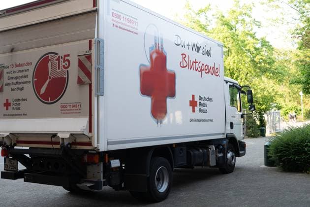 Truck of the DRK blood donation service, general, feature, edge motive, symbol photo topic photos BLUTSPENDE on the occasion of the blood donation campaign of the German Red Cross with the action missingtype to the world blood donation day on 14 June 2023, photo appointment on 05 06 2023 in the school center Pesch in Cologne,