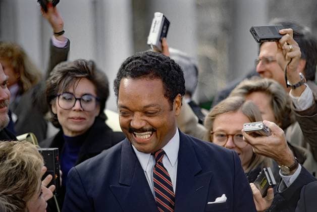November 30, 1988, Washington, District of Columbia, US: The Reverend Jesse Jackson laughs at a question asked by Andrea Mitchell of NBC (lower left corner) during a news conference outside the White House in the West Wing driveway after he and members of the Jackson family had lunch meeting with President-Elect George H.W. Bush Washington US - ZUMAr142 19881130_zap_r142_002 Copyright: xMarkxReinsteinx