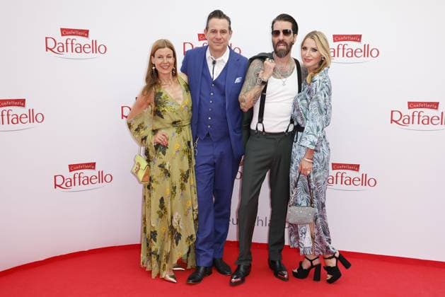 Alec Voelkel with his wife Johanna Michels and Sascha Vollmer with his wife Jenny at the Raffaello Summer Day Event on 21 6 2023 in Berlin Raffaello Summer Day Event 2023 in Berlin