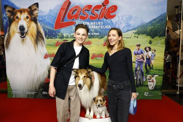 Nico Marischka and Katharina Schuettler with the two film dogs Lassie and Jack Russell Terrier Pippa at the Lassie A New Adventure Film Premiere on 9 06 2023 in Berlin Lassie Film Premiere in Berlin