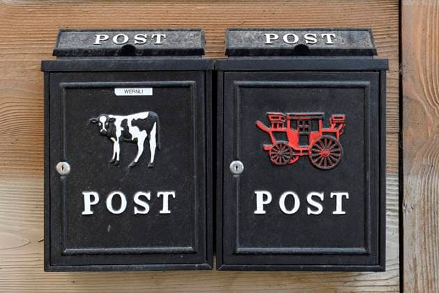 Mailbox with milk cow and carriage icon image, Switzerland, 04 07 2023
