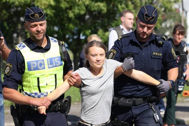 MALMÖ 20230724 Climate activist Greta Thunberg is taken away by police as she takes part in a new climate action in the Oil Harbour in Malmö on Monday The action comes just hours after Thunberg was sentenced to a daily fine for a similar action on June 19 - also in the Oil Harbour MALMÖ Sweden x10600x  Copyright: xAndreasxHillergren TTx GRETA THUNBERG OLJEHAMNEN I MALMÖ TTABB0000000000202682
