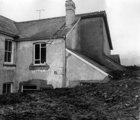 Victim is carried into ambulance AVALANCHE AT ABERFAN - At least 71 people, mostly children have been killed at Aberfan, near Merthyr Tydfil, South Wales, after a rain-soaked coal tip avalanched on an infants school, a farm and a row of houses. Eighty-five children are safe and 36 are in hospital. Photo shows: One of the houses which was engulfed by the avalanche of the killer coal slagheap in Aberfan. Date: 22.10.1966., Credit:Photoshot Avalon United Kingdom  Copyright: xPhotoshotx xAvalonx 0502981627