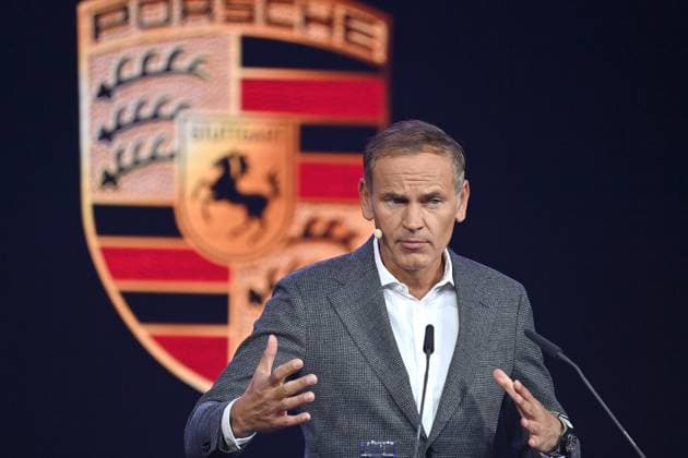 Oliver BLUME Chairman of the Executive Board of Dr Ing h c F Porsche AG and Volkswagen AG at a lecture on 05 09 2023 in front of Porsche logo,brand emblem IAA Mobility 2023 at Messe Riem from 05 09 10 09 2023 in Munich.