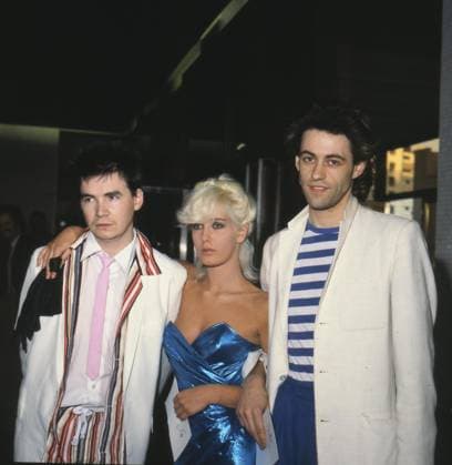 Left to Right: JOHNNIE FINGERS, British Musician, member of the Boomtown Rats; PAULA YATES, British Model and Journalist and her boyfriend BOB GELDOF, Irish Pop Singer, member of the Boomtown Rats COMPULSORY CREDIT: UPPA Photoshot Photo CGP 102635 05 Left to Right: JOHNNIE FINGERS, British Musician, member of the Boomtown Rats; PAULA YATES, British Model and Journalist and her boyfriend BOB GELDOF, Irish Pop Singer, member of the Boomtown Rats COMPULSORY CREDIT: Starstock Photoshot Photo CGP 102635 05.06.1979, Credit:Photoshot Avalon United Kingdom Copyright: xPhotoshotx xAvalonx 0506395672
