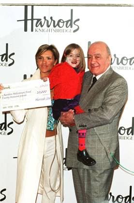 VICTORIA BECKHAM British Pop Singer with MOHAMED AL FAYED Chairman of Harrods At Harrods in London today where Victoria opened the doors at the start of the store s January sale. Seen here with KIRSTY HOWARD, who suffers from a rare heart condition an VICTORIA BECKHAM British Pop Singer with MOHAMED AL FAYED Chairman of Harrods At Harrods in London today where Victoria opened the doors at the start of the store s January sale. Seen here with KIRSTY HOWARD, who suffers from a rare heart condition and attended the event to receive a cheque for Â£20,000 on behalf of Francis House Hospice, which was donated by Harrods COMPULSORY CREDIT: Starstock Photoshot Photo UGL 018884 D-32 02.01.2002, Credit:Photoshot Avalon United Kingdom  Copyright: xPhotoshotx xAvalonx 0506425834