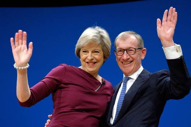 05 10 2016, Birmingham ICC: Conservative Party Conference, Final Day 05 10 2016, Birmingham ICC: Conservative Party Conference, Final Day. Pictured: Prime Minister, Theresa May, with her husband Philip John May . leave the hall at the end of the last day of conference. Photoshot, Credit:Julie Edwards Avalon UK  Copyright: xJuliexEdwardsx xAvalonx 0512228232