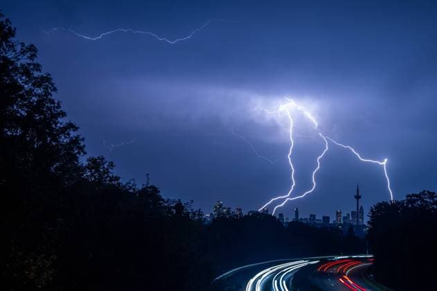 Lightning over Frankfurt Lightning is seen in the evening during a thunderstorm over the skyline of Frankfurt am Main and the highway A661 , Frankfurt am Main Germany