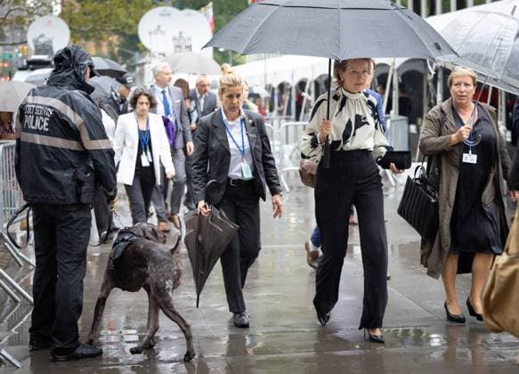 Queen Mathilde of Belgium and Minister for Development Cooperation and Metropolitan Policy Caroline Gennez carry umbrellas as they walk through the rainy streets of New York City, United States of America, Monday 18 September 2023. The 78th session of the United Nations General Assembly (UNGA78) is taking place this week. BENOITxDOPPAGNE 74374703