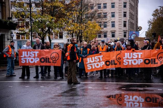 November 18, 2023, London, United Kingdom: A group of protestors hold banners during the demonstration. JUST STOP OIL organisers come together to demand an end to new oil and gas. They state that, The government is waging war on its people, and are fighting back. They re imprisoning peaceful protestors, protecting the real criminals, and licensing more than 100 new oil and gas projects. London United Kingdom - ZUMAs197 20231118_aaa_s197_040 Copyright: xLoredanaxSangiulianox