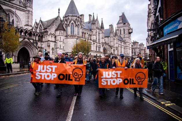 November 18, 2023, London, United Kingdom: A group of protestors hold banners during the demonstration. JUST STOP OIL organisers come together to demand an end to new oil and gas. They state that, The government is waging war on its people, and are fighting back. They re imprisoning peaceful protestors, protecting the real criminals, and licensing more than 100 new oil and gas projects. London United Kingdom - ZUMAs197 20231118_aaa_s197_048 Copyright: xLoredanaxSangiulianox