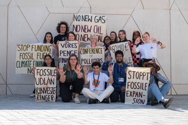 COP28 United Arab Emirates, Dubai on 09 12 2023 Climate activists from Europe protest at the COP28 site with signs like No New Gas, No NEW IOL, No New Coal and Conference of Polluters
