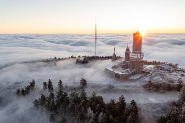 Sunrise above the clouds In the morning, the heights of the Taunus around the Großer Feldberg rise out of a sea of fog, parts of the landscape are covered in hoarfrost , Schmitten Hessen Germany