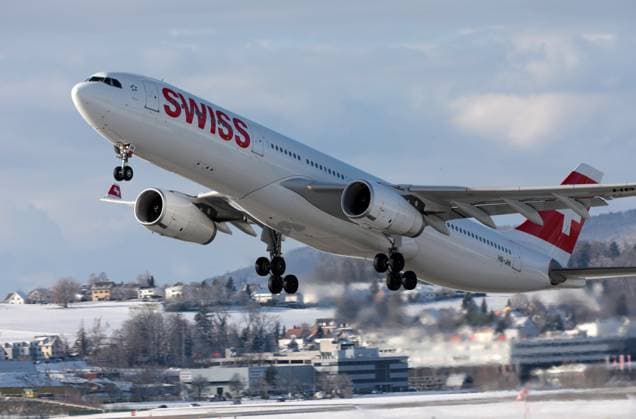Flight operations at Zurich Kloten Airport with passenger aircraft operated by the Swiss airline Swiss International Air Lines