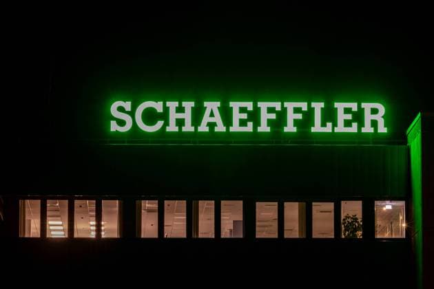 Company in Franconia Illuminated company logo on the headquarters of the stock corporation Schaeffler in Herzogenaurach, Franconia, at night Herzogenaurach Bavaria Germany 20240205-6V2A1499