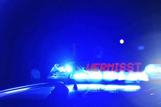 February 7, 2024: Police patrol car at night, with the blue light inscription:Missing. Symbolic image for search for persons and close-range search. PHOTOMONTAGE