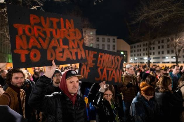 Following the news of the death of Russian opposition politician Alexei Navalny, hundreds of people gathered in front of the Russian embassy in Berlin for a vigil and called for more democracy in Russia snapshot photography K M Krause