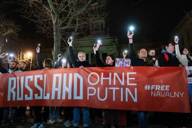 Following the news of the death of Russian opposition politician Alexei Navalny, hundreds of people gathered in front of the Russian embassy in Berlin for a vigil and called for more democracy in Russia snapshot photography K M Krause