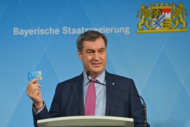 Markus SOEDER State Premier of Bavaria and CSU Chairman presents the payment card Bavarian state government presents the Bavarian payment card for asylum seekers in Munich on 20 March 2024,