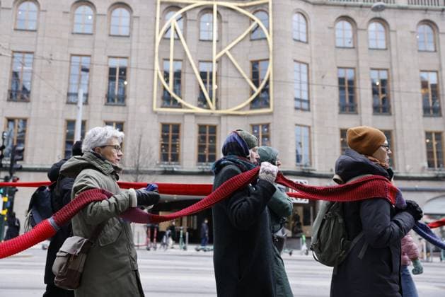 STOCKHOLM 20240421 The Rebel Mothers demonstrate for the 1.5 degree limit by wrapping 4.2 km of red scarves around the Swedish Parliament on April 21, which is Swedens so-called Overshoot Day The action, organized by Extinction Rebellion Sweden, takes through the city from Sergels torg towards the Parliament STOCKHOLM Sweden x12150x  Copyright: xCaisaxRasmussen TTx MANIFESTATION OVERSHOOT DAY SAr6nYDsAQA