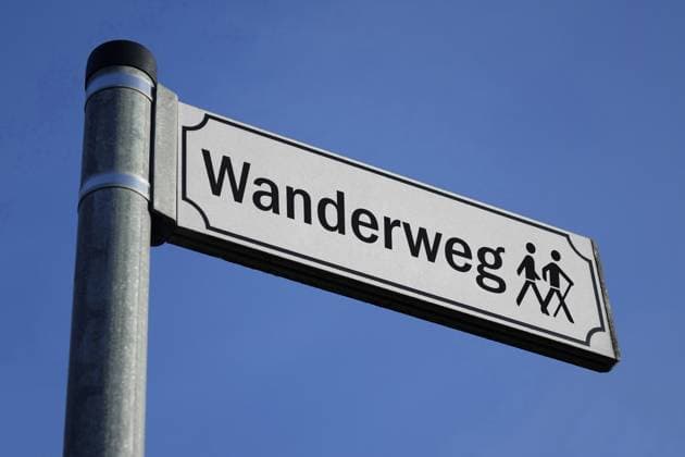 Sign with hiking trail and pictogram Sign with hiking trail and pictogram, 13 05 2024, Borkwalde, Brandenburg, On a sign there is the lettering hiking trail with a pictogram