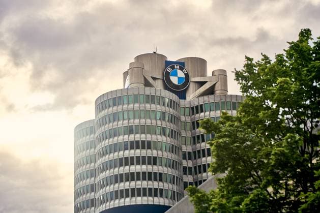 Munich, Bavaria, Germany - June 14, 2024: The BMW headquarters in Munich, Germany, under a cloudy sky. The modern high-rise building with its striking design and the BMW logo is a landmark of the city