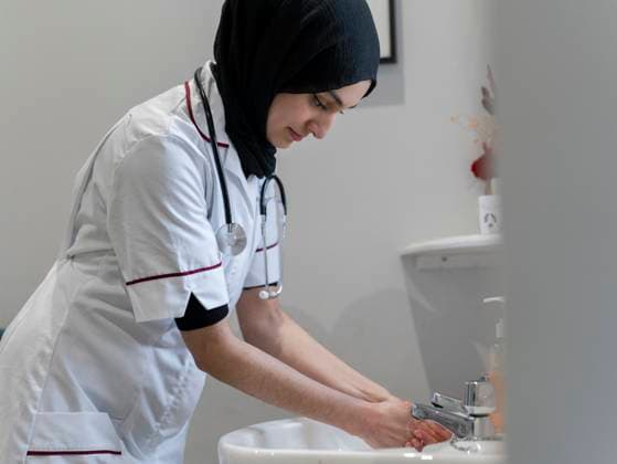 Doctor washing hands in sink model released Copyright: xCulturaxCreativex