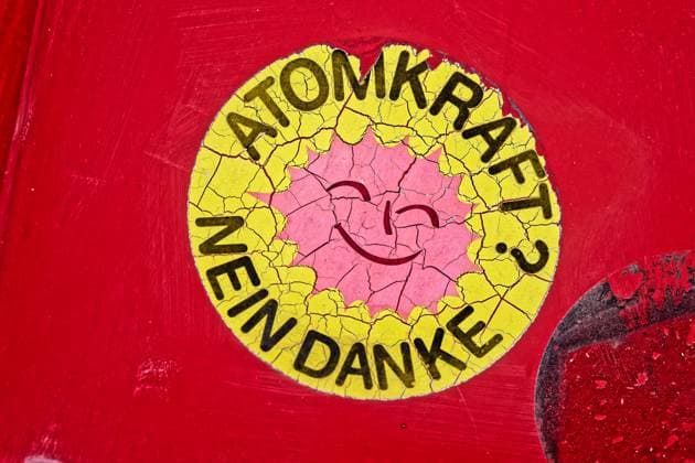 An aging sticker of the anti-nuclear movement on a car Atomkraft Nein danke This sticker is now dissolving after time Traunstein Bavaria Germany Copyright: xRolfxPossx