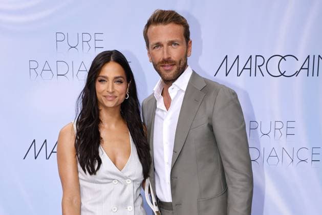 Amira Pocher and Christian Dueren at the Marc Cain Pure Radiance fashion show on 2 07 2024 as part of Fashion Week Berlin in the Colonnade with Triumphtor at the Neues Palais in Potsdam Fashionweek Berlin 2024 Marc Cain Show