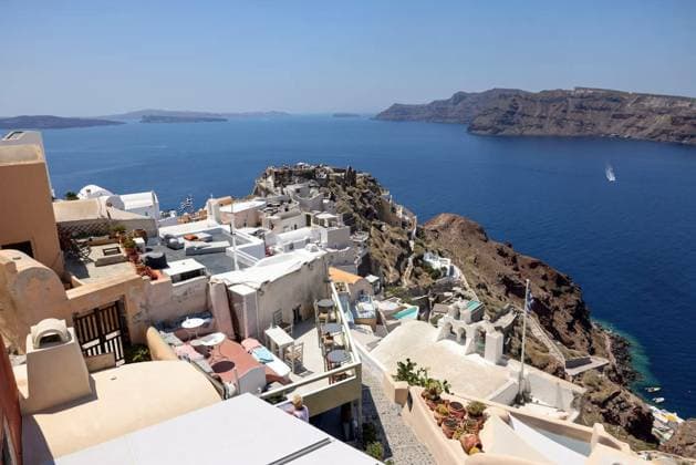 Whitewashed buildings and the ruins of Castle of Agios Nikolaos in Oia village, Santorini, Greece, Oia, Santorini, Greece - July 3, 2021: Whitewashed buildings and the ruins of Castle of Agios Nikolaos on the edge of the caldera cliff, Oia village, Santorini, Greece, Oia, Santorini, Greece - July 3, 2021: Whitewashed buildings and the ruins of Castle of Agios Nikolaos on the edge of the caldera cliff, Oia village, Santorini, Greece, 07.06.2023, Copyright: xwjarekx Panthermedia35078444.jpg