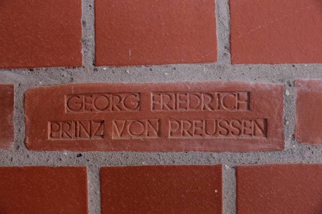 Georg Friedrich Prince of Prussia stands as a donor on a walled brick in the stairwell of the rebuilt tower of the Garrison Church during a press conference for the inauguration ceremony, Potsdam, August 6, 2024 Garrison Church Potsdam