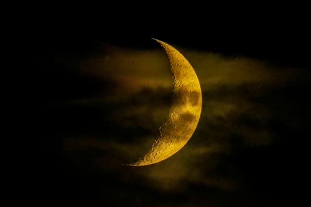 Crescent moon, waxing moon in a cloudy sky Offenbach am Main Hesse Germany
