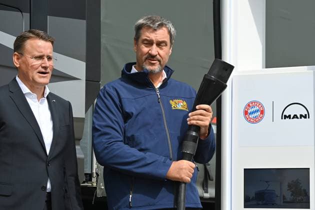 From left Alexander Vlaskamp CEO of MAN Truck and Bus SE , Markus SOEDER State Premier of Bavaria and CSU Chairman , Starting signal for the construction of an electric charging park for commercial vehicles at the Allianz Arena Cooperation project between FC Bayern Munich and MAN Truck and Bus on 27 08 2024