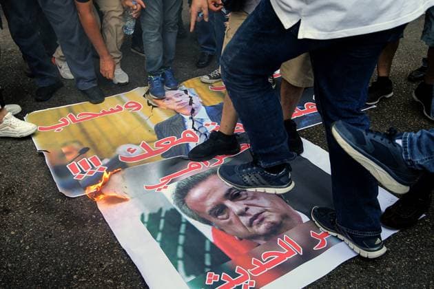 September 5, 2024, Beirut, Beirut, Lebanon: Depositors step on the pictures of LebanonÃ¢â‚¬â ¢s former central bank governor Riad Salameh before burning them outside the countryÃ¢â‚¬â ¢s judiciary palace in Beirut. Scores of Lebanese depositors gathered outside the magistrates demanding the trial of Salameh, who was arrested over embezzlement, money-laundering and fraud. Beirut Lebanon - ZUMAn313 20240905_zip_n313_008 Copyright: xMarwanxNaamanix